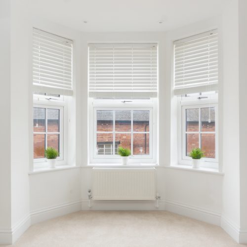 An,Empty,Modern,Room,In,An,Urban,Apartment,With,Plain